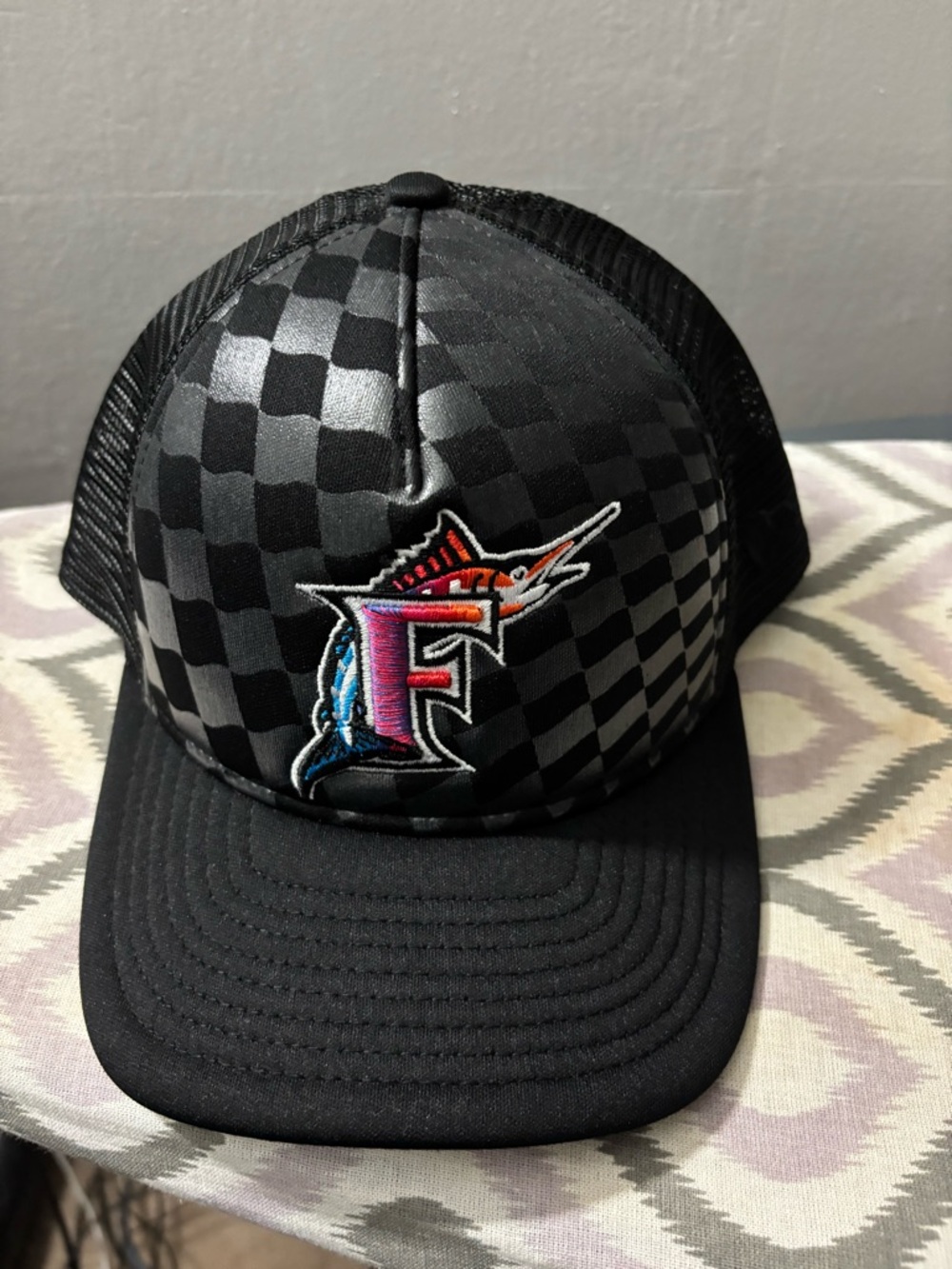 New Era Black Checkered Trucker Hat with Colorful Marlin F Patch